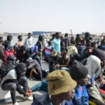 a boat filled with migrants from sub-saharan Africa countries on their way to Tunisia