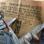 A historical newspaper clipping from the News Chronicle dated August 7, 1945, with the headline announcing the use of the atomic bomb on Japan. The display includes a model airplane, a black-and-white photograph of the Hiroshima explosion, and descriptive text in Turkish about the B-29 bomber and nuclear bombings.